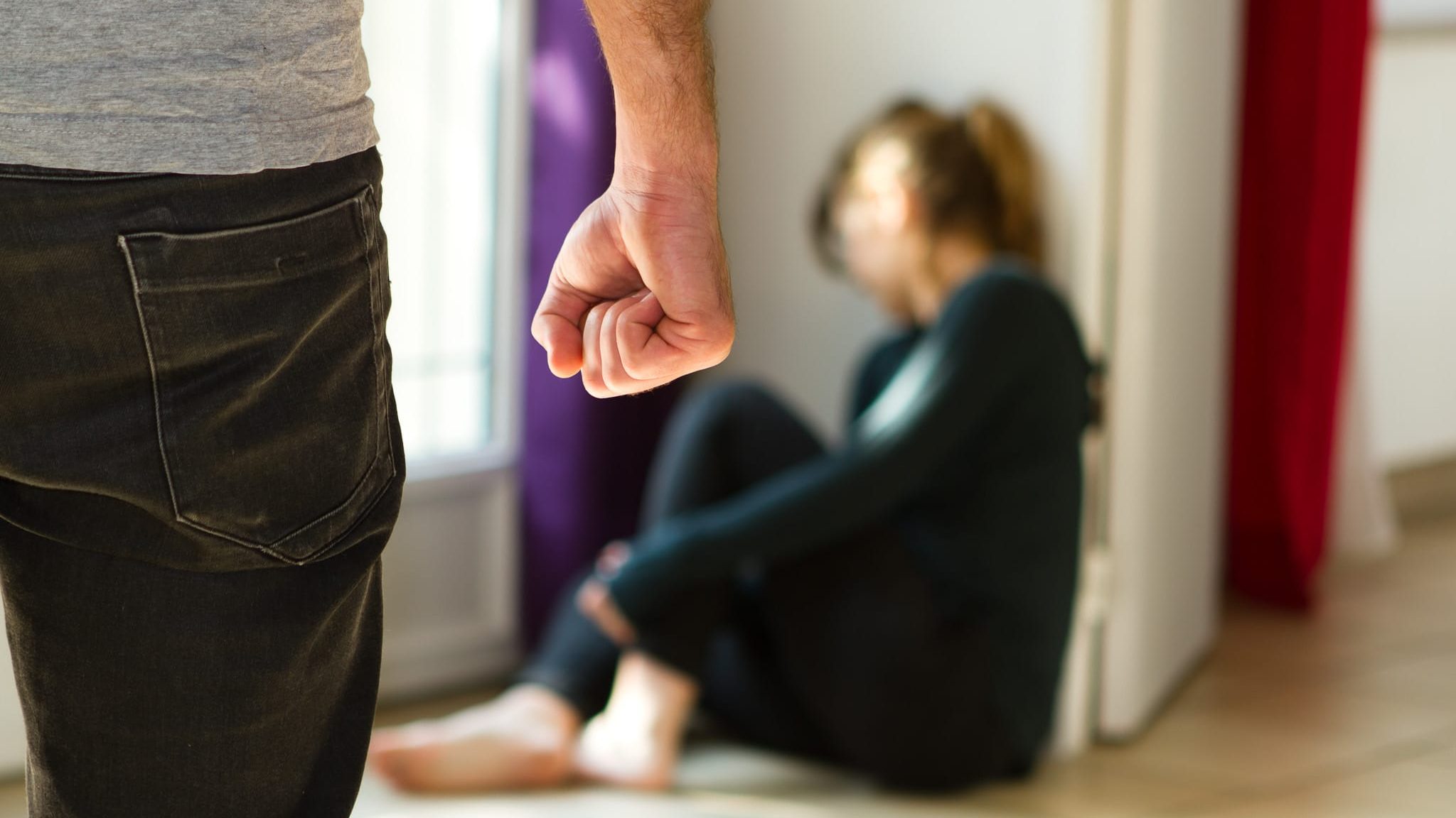 Domestic violence Man beating up his wife illustrating domestic violence